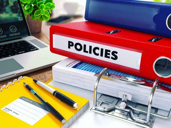 Policies - Red Ring Binder on Office Desktop with Office Supplies and Modern Laptop. Business Concept on Blurred Background. Toned Illustration.-1