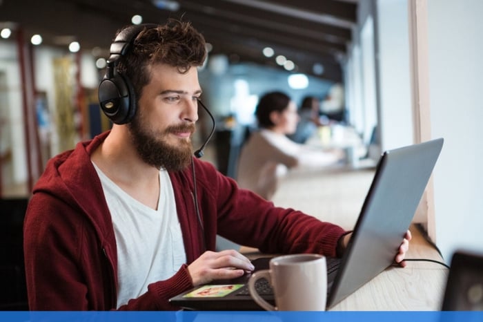 Young student remote working in a cafe