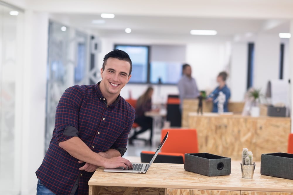 portrait of young businessman in casual clothes at modern  startup business office space,  working on laptop  computer-1